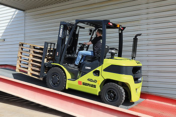 Auto engaging electric parking brake with rollback protection on gradients and ramps Auto engaging electric parking brake with rollback protection on gradients and ramps